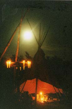 Glastonbury red tipi with moon and chandelier
